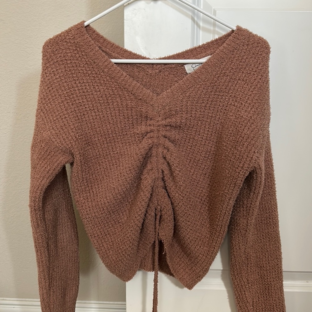 dull pink sweater